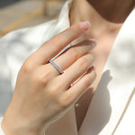 Load image into Gallery viewer, Close-up of a hand wearing Célébration Éternelle Moissanite Band