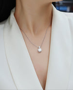 Load image into Gallery viewer, Double Éclat Moissanite Necklace on a model.