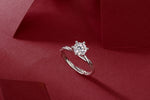 Load image into Gallery viewer, Éclat Entrelacé Moissanite Ring on a red fabric background