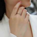 Load image into Gallery viewer, Close-up of a hand wearing Élégance Twistée Moissanite Band