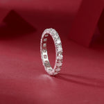 Load image into Gallery viewer, Éternelle Majesté Moissanite Band on a red fabric background