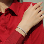 Load image into Gallery viewer, Person wearing a red shirt with a moissanite tennis bracelet