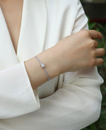 Load image into Gallery viewer, Model wearing Stellaire Cube Moissanite Bracelet