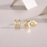 Load image into Gallery viewer, A pair of Aurum Mosaic Stud Earrings featuring geometric silhouette with round-cut moissanite stones set in gold-plated sterling silver.
