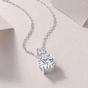 A moissanite silver necklace featuring a dual-stone design with round-cut moissanite stones.