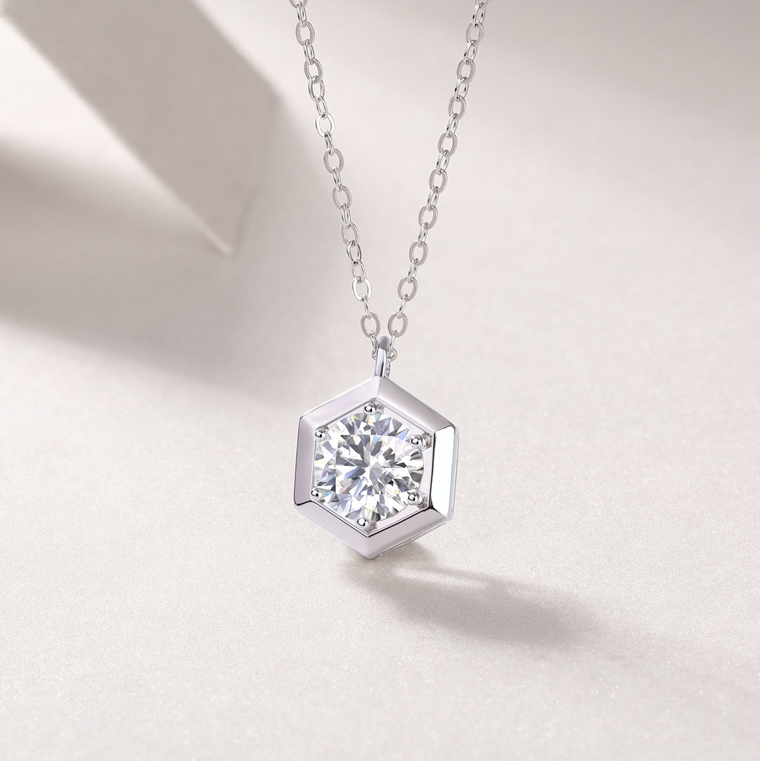 Éclat Hexagonal Moissanite Necklace featuring a round-cut moissanite stone in a hexagonal pendant design.