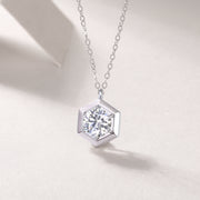 Éclat Hexagonal Moissanite Necklace featuring a round-cut moissanite stone in a hexagonal pendant design.