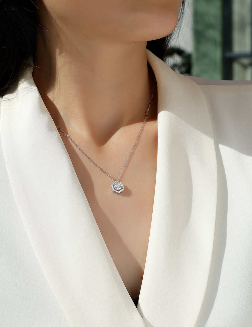 Éclat Hexagonal Moissanite Necklace worn by a person in a white blazer.
