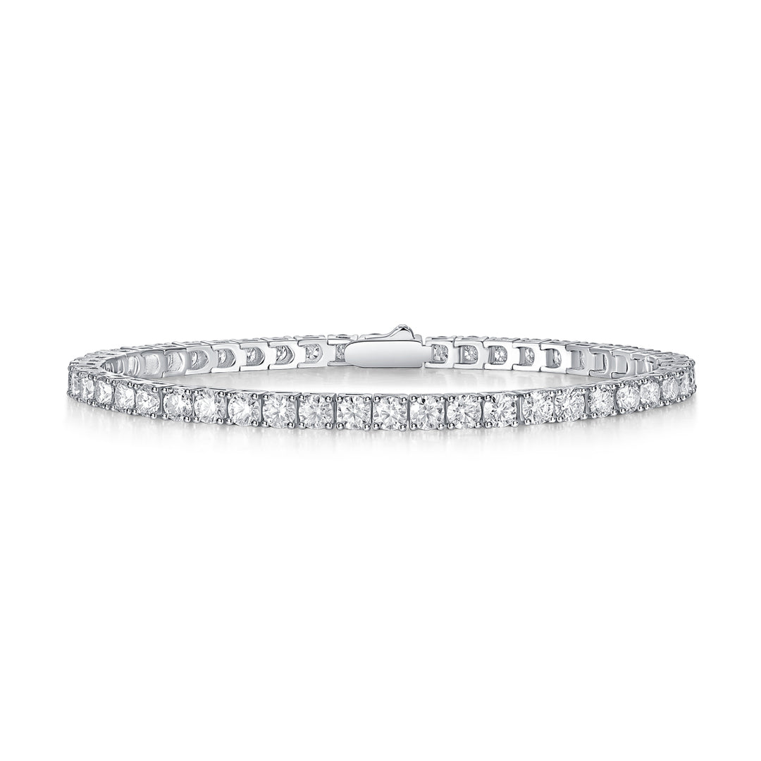 A tennis bracelet featuring round-cut moissanite stones set in a row, with a secure clasp, against a white background.