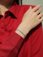 Load image into Gallery viewer, Person wearing a red shirt with a moissanite tennis bracelet
