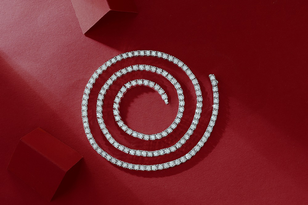 Lumiere Eternelle Moissanite Tennis Necklace on a red background