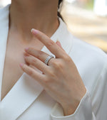 Load image into Gallery viewer, Close-up of a hand wearing a Pavé Royale Moissanite Band
