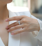 Load image into Gallery viewer, Close-up of a hand wearing Pavé Royale Moissanite Band

