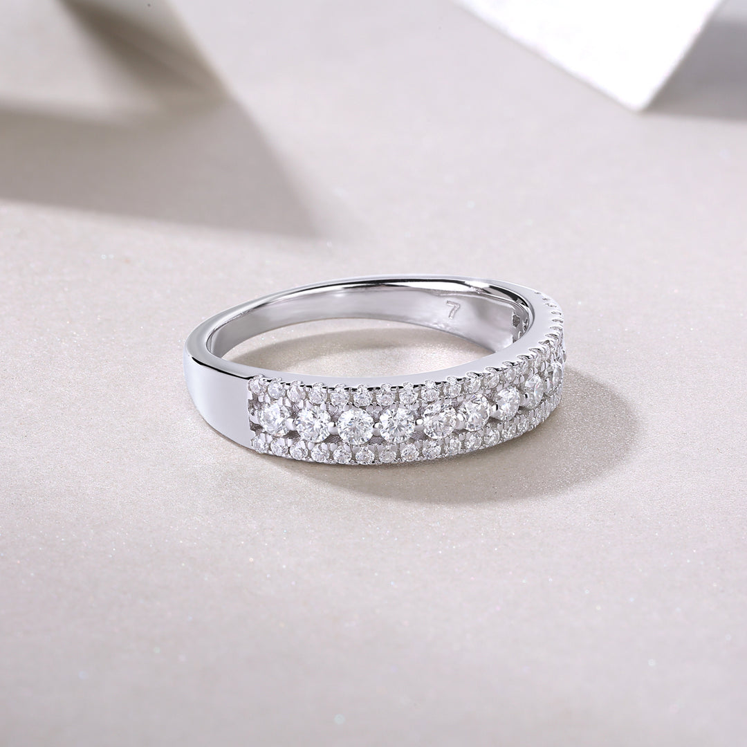 Pavé Trinity Moissanite Band with multiple round-cut moissanite stones set in a pavé design.