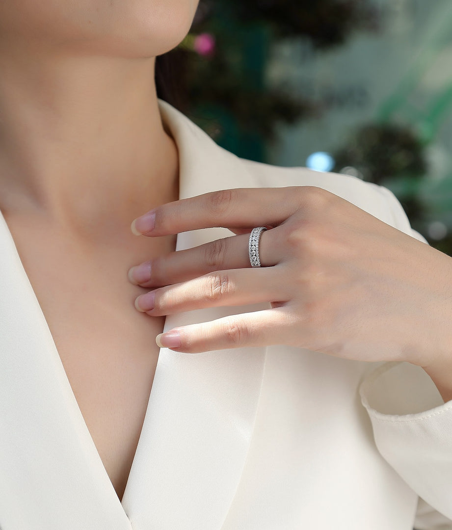 Close-up of a hand wearing a Pavé Trinity Moissanite Band