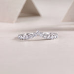 Load image into Gallery viewer, Tiare Princesse Moissanite Ring with round-cut moissanite stones set in a four-prong configuration.
