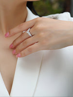Load image into Gallery viewer, Close-up of a woman&#39;s hand wearing Tiare Royale Moissanite Ring
