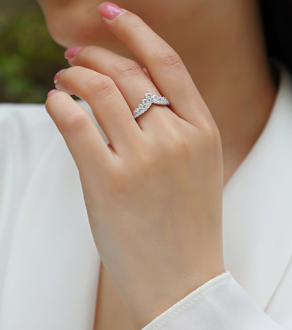 Close-up of a hand wearing Tiare Royale Moissanite Ring