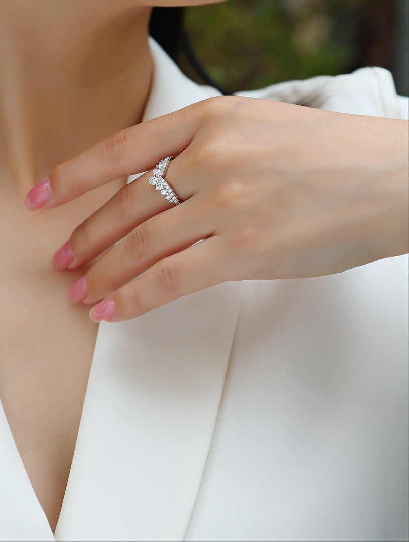 Close-up of a woman's hand wearing Tiare Royale Moissanite Ring