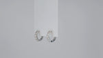 Load and play video in Gallery viewer, Lumière Éternelle Moissanite Huggie Earrings
